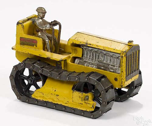 Arcade cast iron Caterpillar tractor with a nickel-plated driver, 7 1/2'' l.