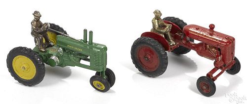 Two Arcade cast iron farm tractors with nickel-plated drivers, to include a John Deere, 7 1/2'' l