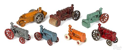 Seven small cast iron tractors and road rollers, largest - 5 3/8'' l.