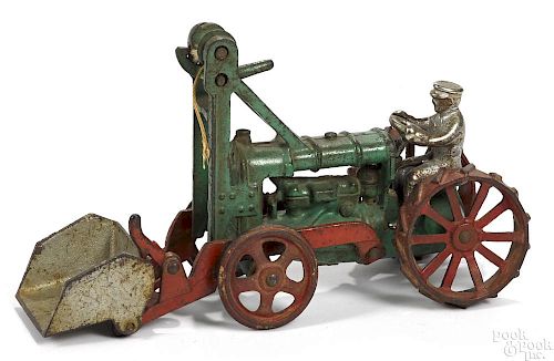 Scarce Hubley cast iron tractor with a front scoop and a nickel-plated driver, 9 1/4'' l.