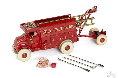 Hubley cast iron red Bell Telephone truck with a painted driver, together with a trailer