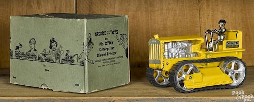 Arcade cast iron Caterpillar Diesel tractor with a nickel-plated driver and the original box
