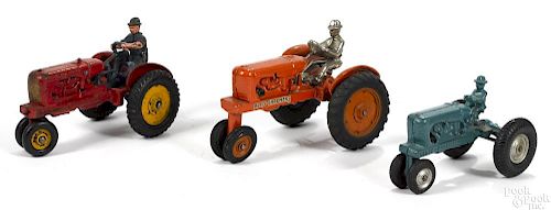 Three Arcade cast iron Allis Chalmers tractors, to include one with a nickel-plated driver
