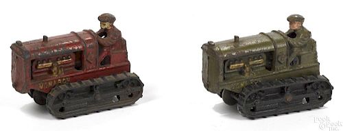Two Hubley cast iron Monarch tractors with painted drivers, 5 1/4'' l.