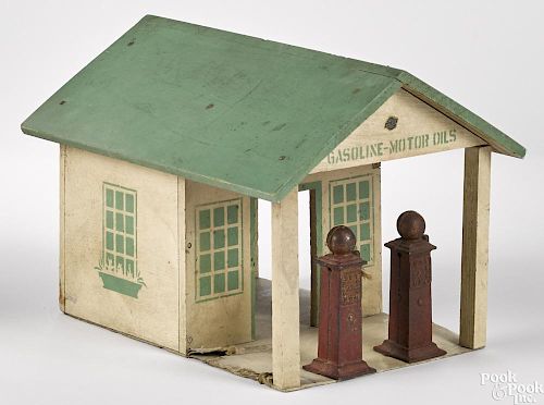 Arcade painted wood Gasoline-Motor Oils filling station with two cast iron pumps, 9'' h., 12'' d.