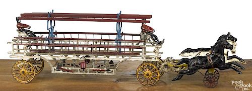 Large Wilkins cast iron horse drawn ladder wagon with painted cast iron drivers