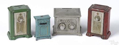 Four cast iron radio still banks, to include three Kenton and one Hubley, tallest - 4 1/4''.