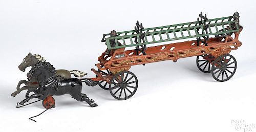 Ives cast iron horse drawn ladder wagon with ladder hangers and original drivers, 22'' l.