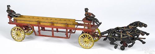Wilkins cast iron horse drawn ladder wagon, early version, with a bell ringing mechanism