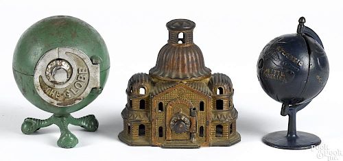 Three cast iron still banks, to include an Arcade dome top, 5'' h., a Grey Iron globe, 5 3/4'' h.