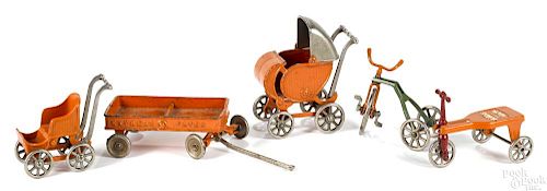 Five Kilgore cast iron buggies, wagons, and scooters, tallest - 5 1/2''.