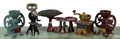 Four Arcade cast iron kitchen toys, to include two coffee mills