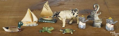 Nine cast iron paperweights and novelties, to include an elephant bottle opener, a duck, a turtle