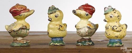 Four Hubley cast iron duck paperweights and figures, 2 1/4'' h.
