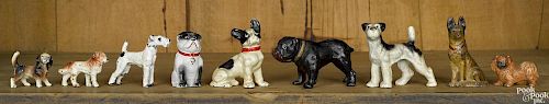 Nine cast iron dog paperweights and figures, tallest - 3 1/4''.