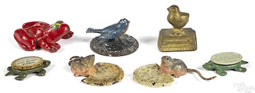 Seven figural cast iron animal novelties and paperweights, to include a Dempster frog, 3'' l.
