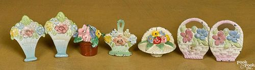 Seven Hubley cast iron flower paperweights and novelties, tallest - 2''.