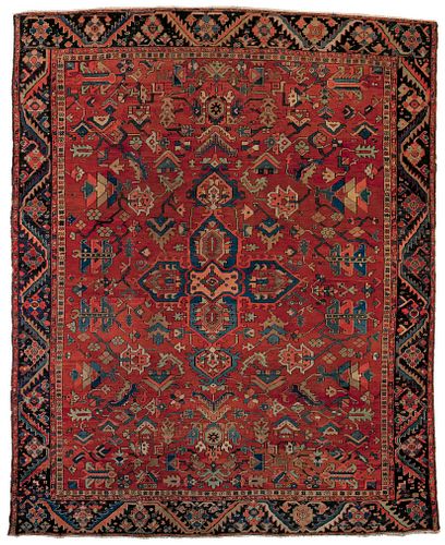 Roomsize Heriz rug, ca. 1920, with a central medal