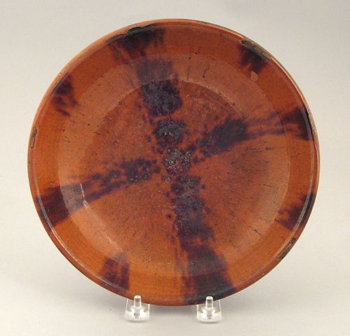 Redware shallow bowl, 19th c., with manganese cros