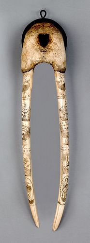 Scrimshaw walrus tusk, 19th c., signed "Thos-Haine