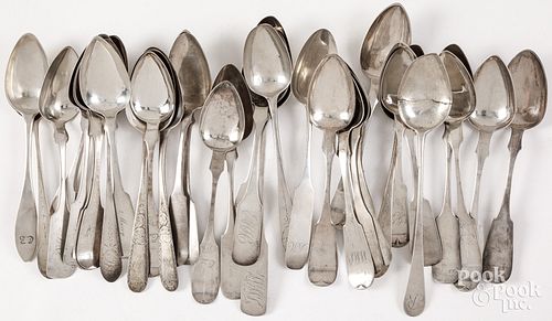 Silver serving spoons, mostly coin