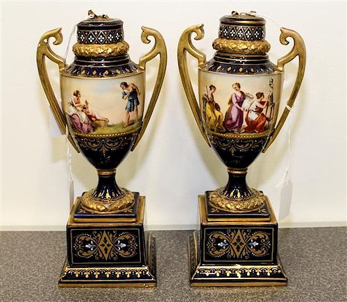 * A Pair of Vienna Porcelain Urns Height 10 3/4 inches.