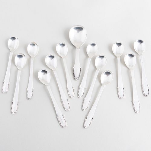 Set of Twelve Georg Jensen Silver Coffee Spoons and a Larger Spoon