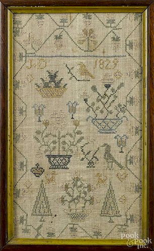 Silk on linen sampler, initialed J. D. and dated 1829, with a trailing vine border