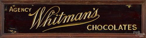 Whitman's Chocolate reverse painted on glass agency advertising sign, 20th c., 5 3/4'' x 27 1/2''.