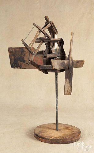 Primitive pine whirligig of a man sawing, ca. 1900, with a Dutch Cleanser shipping box