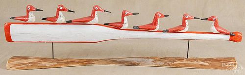 Group of seven carved and painted birds mounted to a paddle, 20th c., 42 1/2'' l.