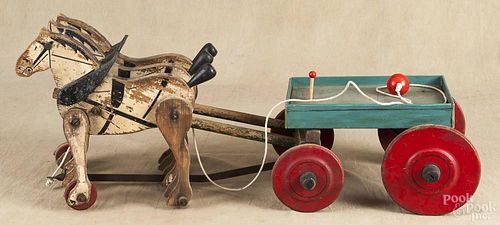 Carved and painted wood horse and wagon toy, early 20th c., with a three-horse team, 29'' l.