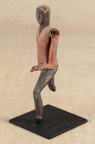 Carved and painted figure of a running man, 19th c., 12 1/4'' h. Provenance: Bernard Barenholtz