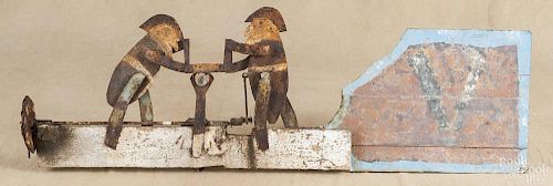 Painted tin whirligig of two men sawing wood, early 20th c., 35 1/4'' l.