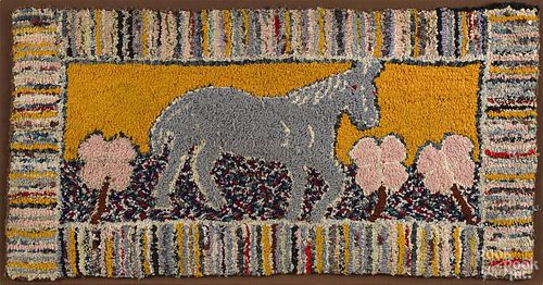 Hooked rug of a horse and a four-leaf clover, early 20th c., 19'' x 36''.