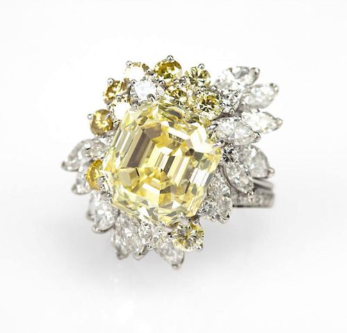 A natural fancy yellow diamond and platinum ring