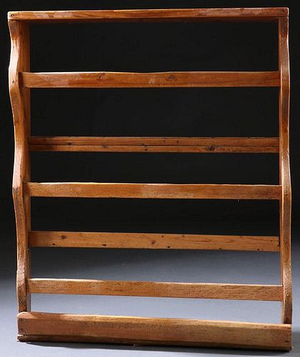 AN EARLY AMERICAN PINE PLATE RACK, LATE 18TH C