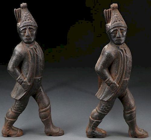 A PAIR OF CAST IRON HESSIAN SOLDIER ANDIRONS