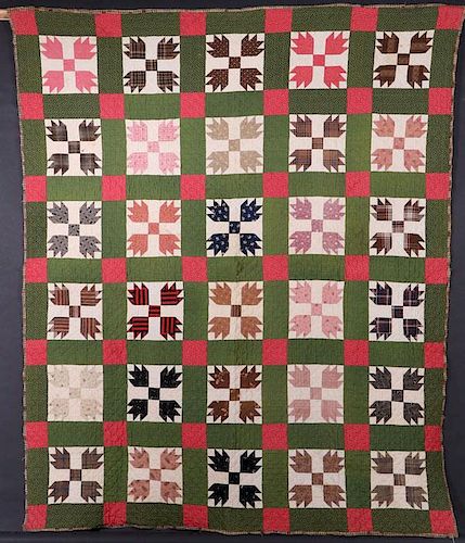 A 19TH CENTURY HAND STITCHED QUILT