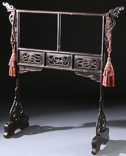 A CHINESE CARVED AND EBONIZED GARMENT STAND