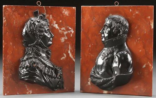 A PAIR OF CAST IRON RELIEF PROFILE BUST PLAQUES