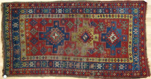 Two Kazak throw rugs, ca. 1900, together with 2 ma