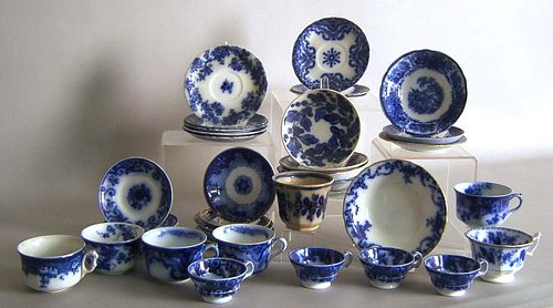 Group of flow blue cups and saucers.