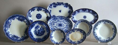 Ten pieces of flow blue to include bowls, small pl