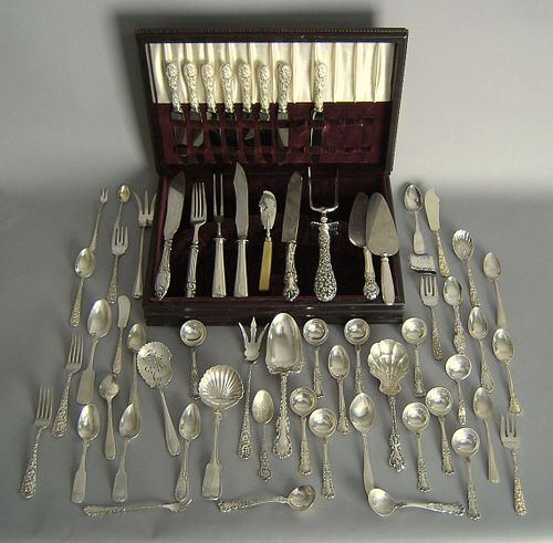 Large group of sterling silver flatware and servin
