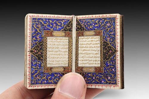 An Islamic Miniature Quran written in 1199 by Fatimah bint Ustad Yahya Helmy with a Silver Case

Height: Approximately 5cm
Length: Approximately 4cm

