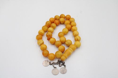An Islamic Large Butterscotch Amber Prayer Beads with White Metal Tassel  

Weight: 188g with White Metal included
Each Bead: Approximately 1.7cm 
