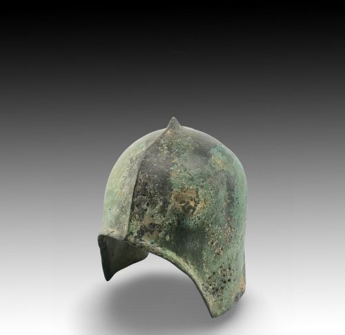 An Ancient Roman Helmet with Lovely Patina

Height: Approximately 23cm 