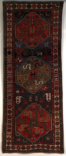 Cloudband Kazak long rug, ca. 1900, with 3 medalli