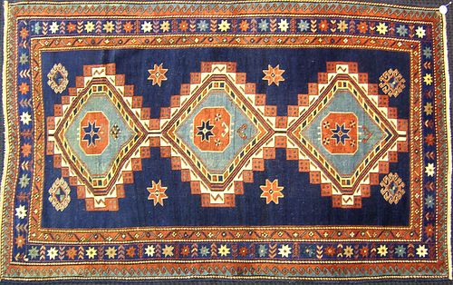 Kazak throw rug, ca. 1900, with 3 medallions on al